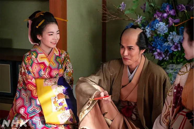 被漂亮遊女哄得眉開眼笑的午之助