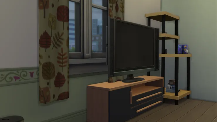 電視機、電視櫃和架子用了黑、啡色，感覺一致，也呼應黑色真皮沙發。