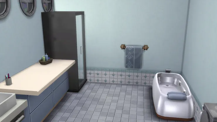 洗手間以淺藍和白為主色，帶出輕鬆的氛圍。