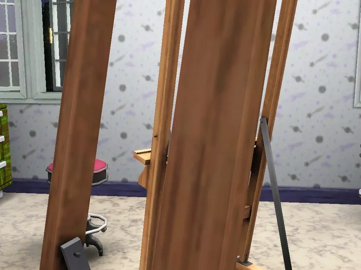 木質的畫架不知現在多不多見？我那個不是木的，像是相機架那樣。