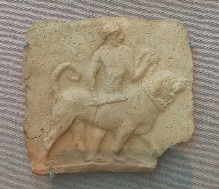 陶土牌匾，描繪了一名男子牽著一隻狗。博爾西帕 (Borsippa)（美索不達米亞），西元前2千年早期。