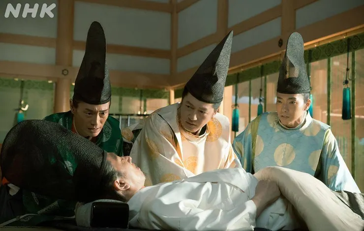 在父親床前焦急守候的三兄弟