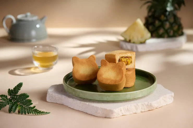 圖說:旺萊山從嘉義民雄的舊稱「打貓」汲取靈感,將經典鳳梨酥製作成Q萌可愛的貓咪造型,巧妙結合在地文化與美食。(資料來源:旺萊山)