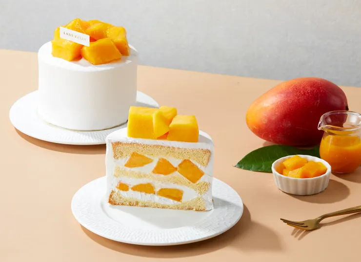 圖說：芒果鮮奶油蛋糕以黃金戚風夾入輕盈鮮奶油與飽滿果肉，剖面滿滿都是新鮮芒果，口感香甜多汁。（資料來源：LADY KELLY）