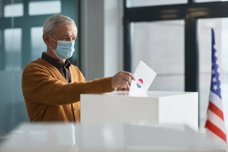 Photo by Edmond Dantès from Pexels: https://www.pexels.com/photo/an-elderly-man-dropping-a-paper-in-a-ballot-box-7103205/