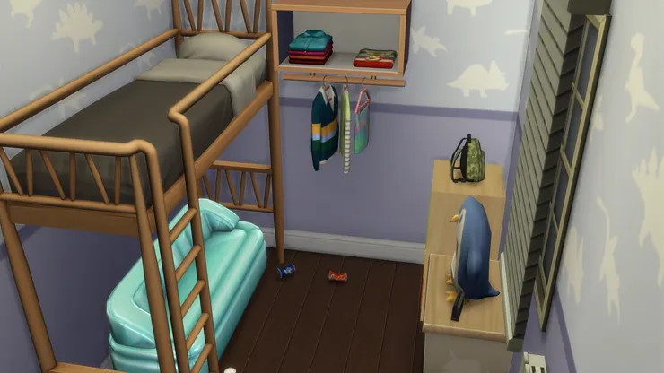 男孩子睡的高架床,下面放了沙發,配上電視機也成了一個小客廳,可以招呼同伴來玩遊戲機。