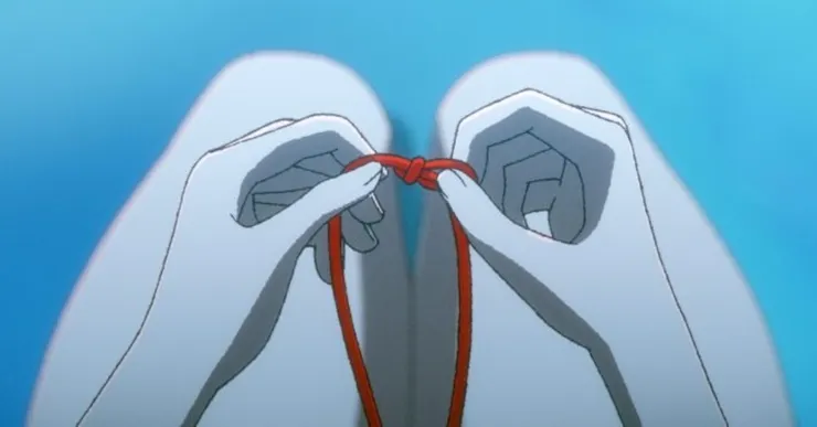 繫於紅繩上的結,代表未解的遺憾