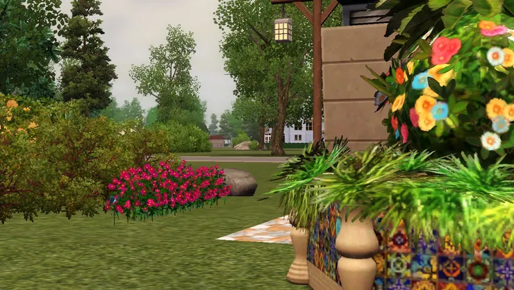 公園裏的花草跟附近的樹木互相輝映。