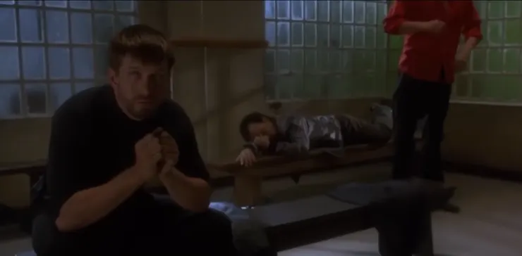 hockney lying on the chair behind