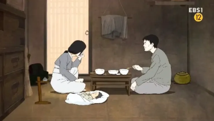 家徒四壁的金僉知在家與妻兒吃飯