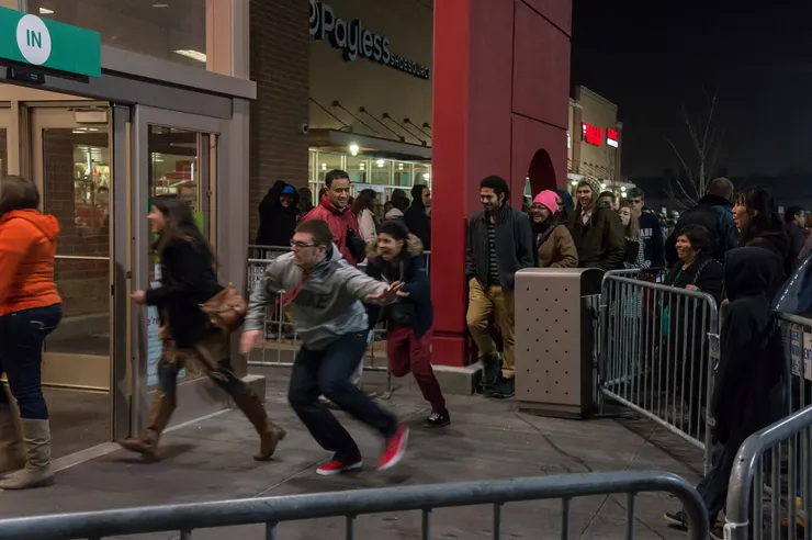 Shoppers rushing into a Target store as it opens on Black Friday, 2013