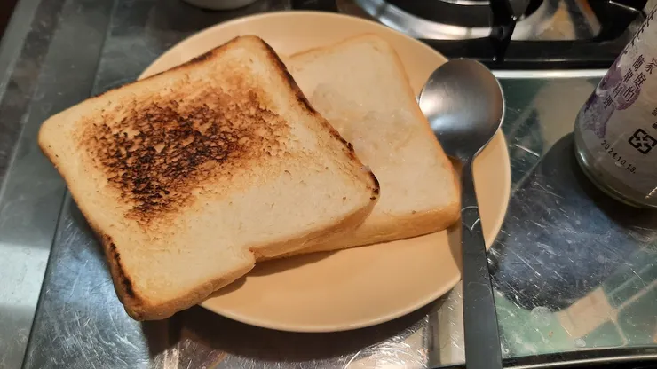 哈不小心一面煎焦掉了