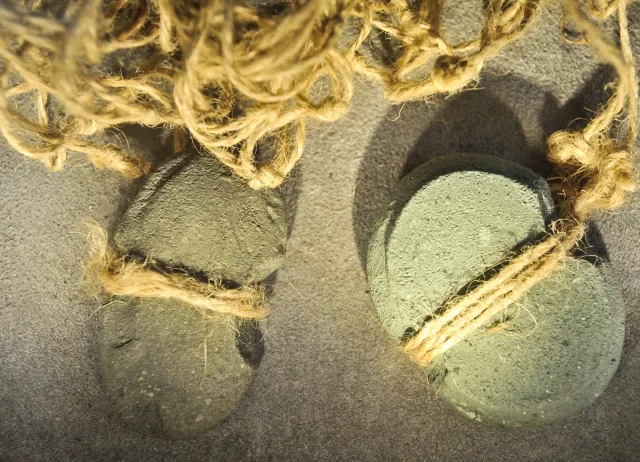 石網墜的用途示意（圖片來源：台史博線上博物館）