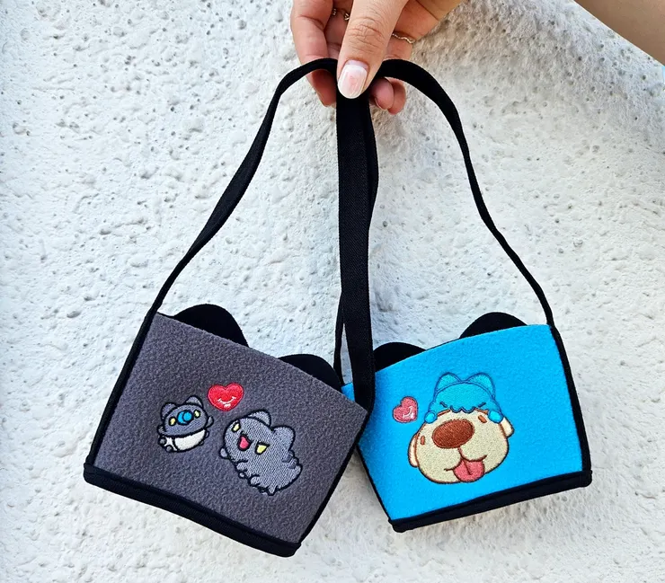 圖說：半截造型提袋共有咖波及黑貓蟲共2款，超萌的耳朵造型可愛爆擊！（資料來源：清心福全）