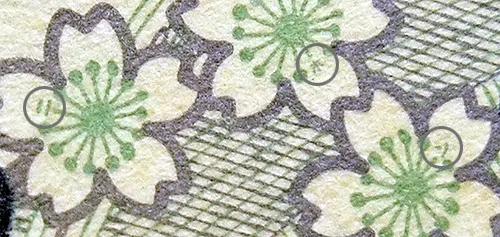 「ニ、ホ、ン」三個片假名就藏在千元鈔背面右上角的三朵櫻花...的花蕊上/照片來源:網頁資訊