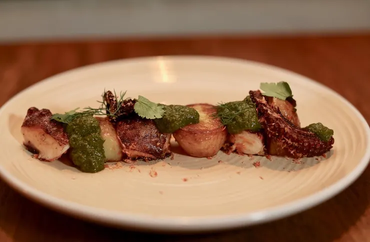 Octopus with green mojo sauce