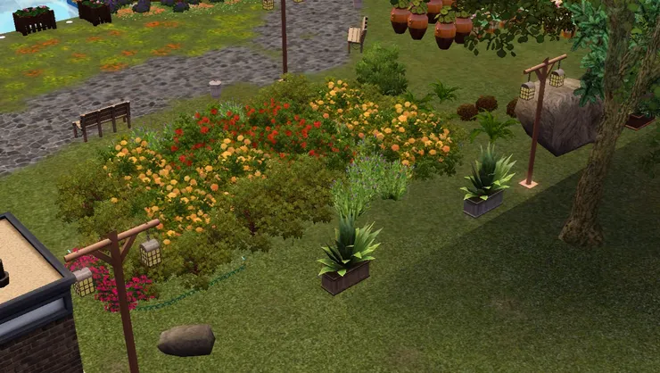 花圃後面放了一些大盆植物和石頭，顯示公園的邊界。