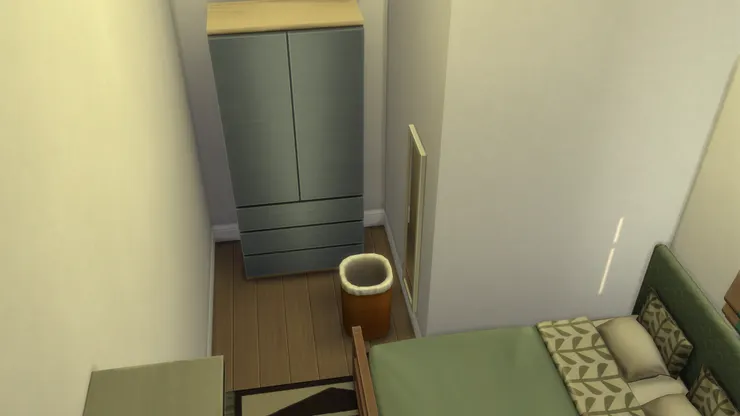 這裏剛好有個凹位,用來放衣櫃正好;旁邊那個是污衣籃,可不是垃圾桶。