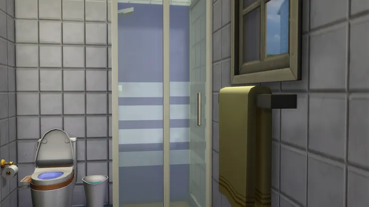 淋浴間以灰藍主色，跟磁磚相配。