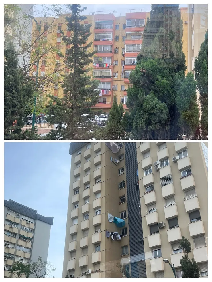 車水馬龍的馬拉加，大樓外有曬衣的萬國旗。