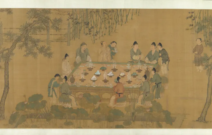 傳 宋徽宗《十八學士圖》 桌上也是擺著高高如寶塔狀，供「看盤」用的仿生「水果」與「蜜煎」