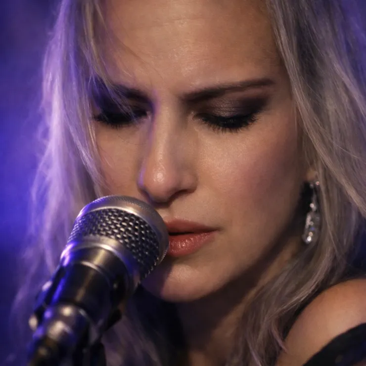 She did this not with commands, but with patience, lowering her gaze as if listening to a tide moving beneath stone.