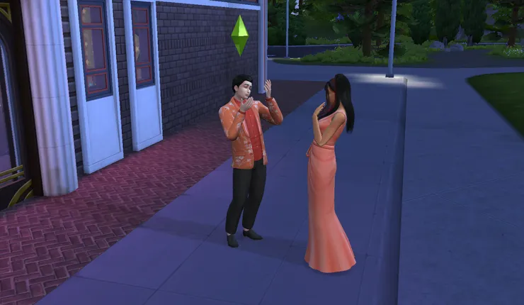 兩人都穿著粉橘色的套裝...