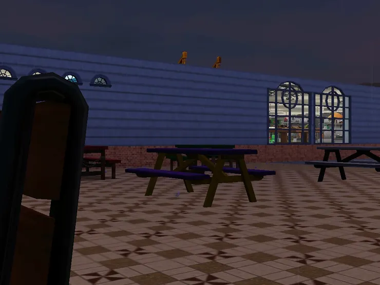 沒有太陽傘的桌子這邊向著書店,較暗。