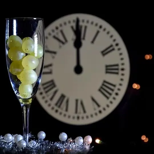 Eating twelve grapes.