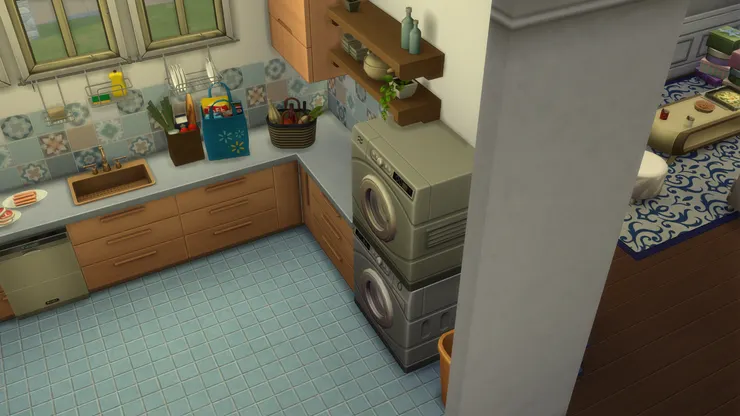 廚房的佈置挺分明，左邊是煮食區、中間是洗理台，而右邊是洗衣和雜物區。