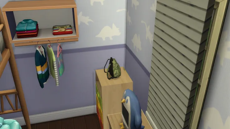 壁紙用了紫藍色,男性化得來不會剛陽味太重,配上可愛的恐龍圖案。