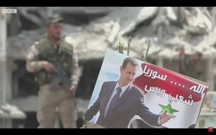海報上人物為敘利亞總統阿賽德