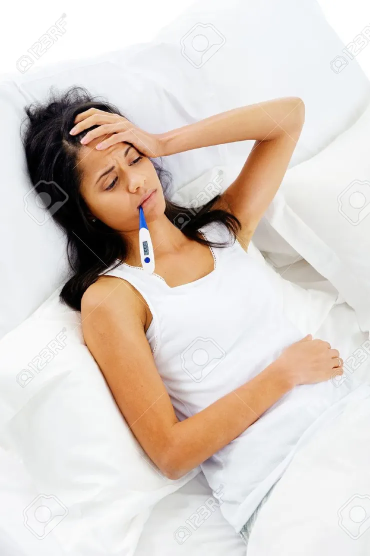 Ill Woman Taking Her Temperatur In Bed Wile Feeling Sick And With Fever  Stock Photo, Picture and Royalty Free Image. Image 15981383.