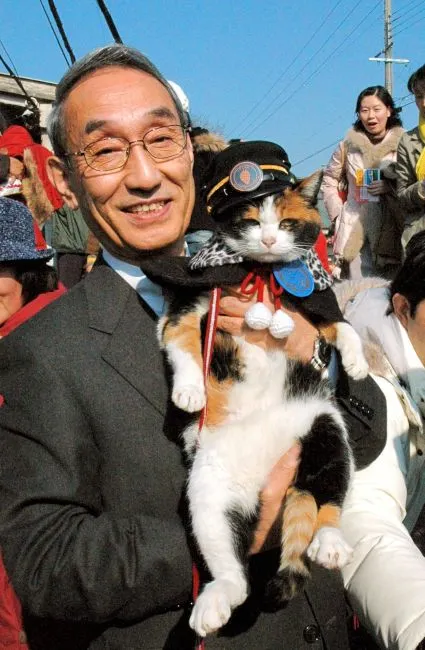 小嶋光信和小玉站長（來源：朝日新聞）