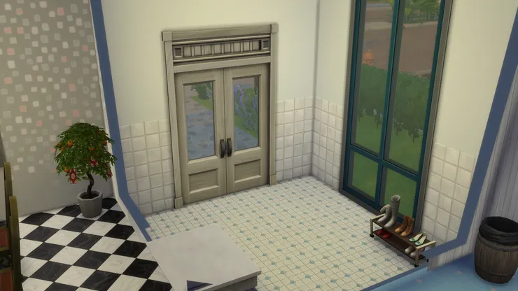 從大門一進來當然是玄關。這個房子有個很明顯的玄關，放了鞋架。