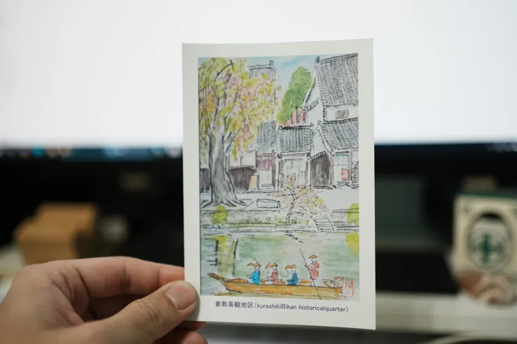 他送的複製版卡片，地點就是美觀地區，季節是春末