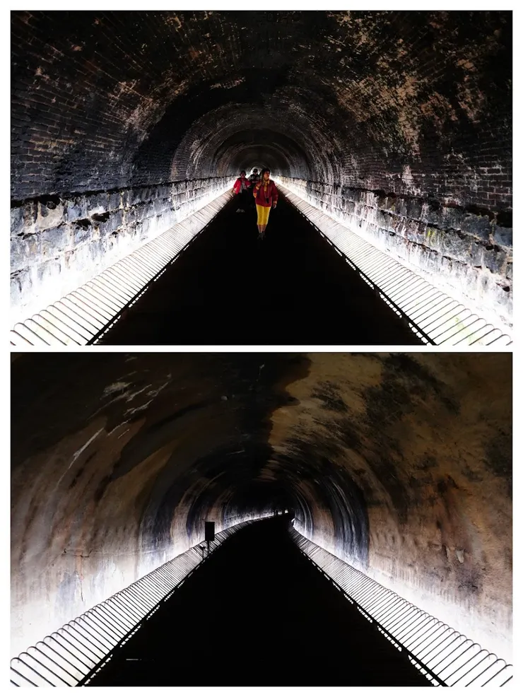 隧道內從地面兩側間接投射燈光， 隧道建造是砌石加上磚拱， 隱約可以看到被煙燻黑的痕跡。