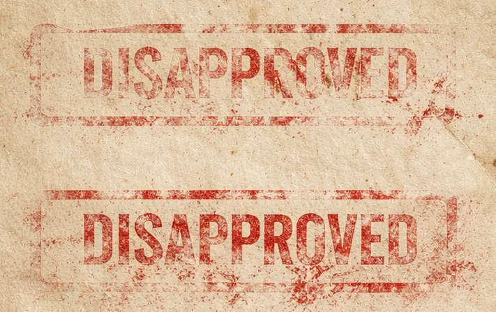 陳舊的紙張，紅色 disapproved 的戳記