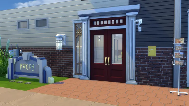 校門我特意用了感覺傳統、帶點古典的款式，但不會過於華麗。另外我想大家留意一下門前的地磚。