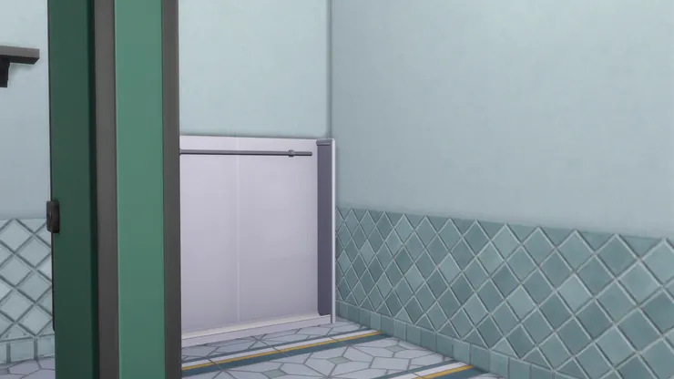 我很想大家留意一下地磚，顏色有灰、藍、深綠和黃色，跟這洗手間的用色非常相配。