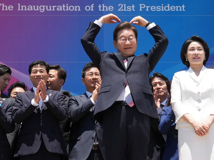 Lee Jae-myung and wife Kim Hye-kyung greet supporters after his inauguration at the National Assembly in Seoul. Photo: Reuters