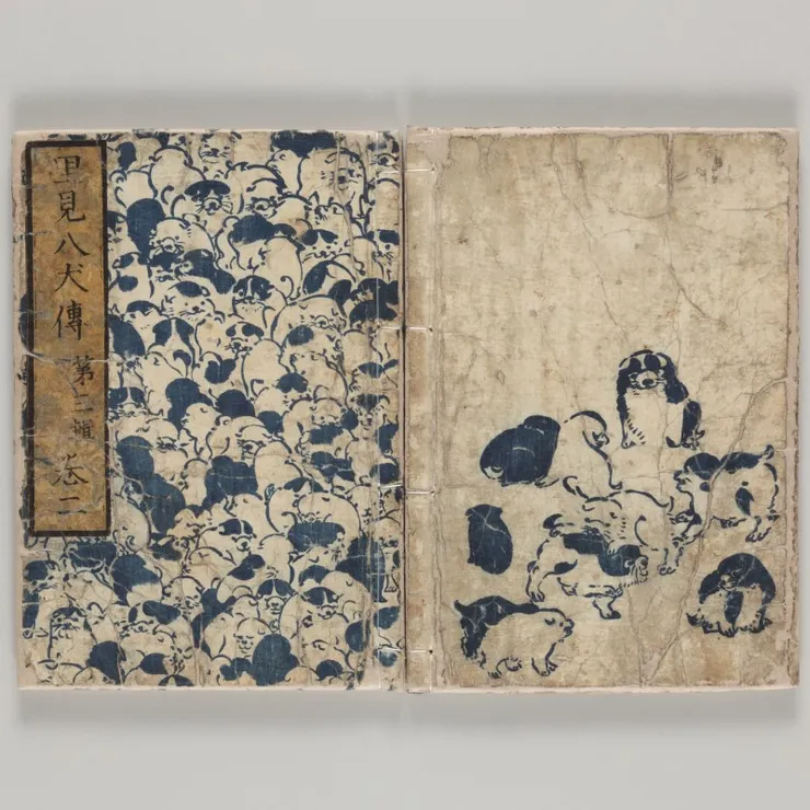 南總里見八犬傳，江戶時代出版的封面。可以看見可愛的毛茸茸狗狗有一大堆啊。引自印刷博物館X