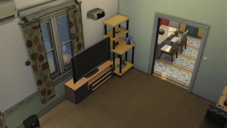 起居空間以綠、啡和黑為主色，連窗簾也相配。我挺喜歡綠色帶來的清新和中性感覺。