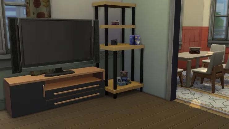 電視機旁的架子放著遊戲機。小麥可和佩兒常常會對戰。