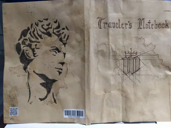 用回收的牛皮紙信封袋，再加一點自己的設計做成封面