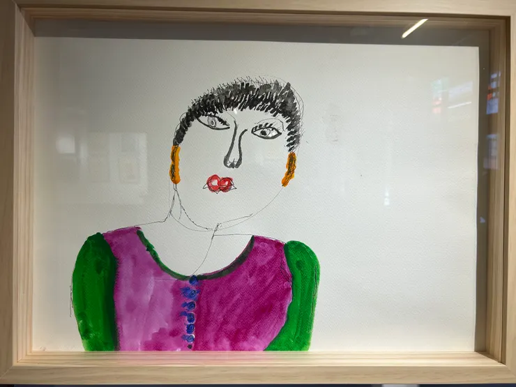 此圖展覽中一位重度失智阿嬤畫媽媽的作品。